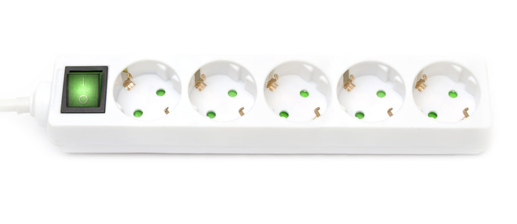 Green power strip, socket - on white background